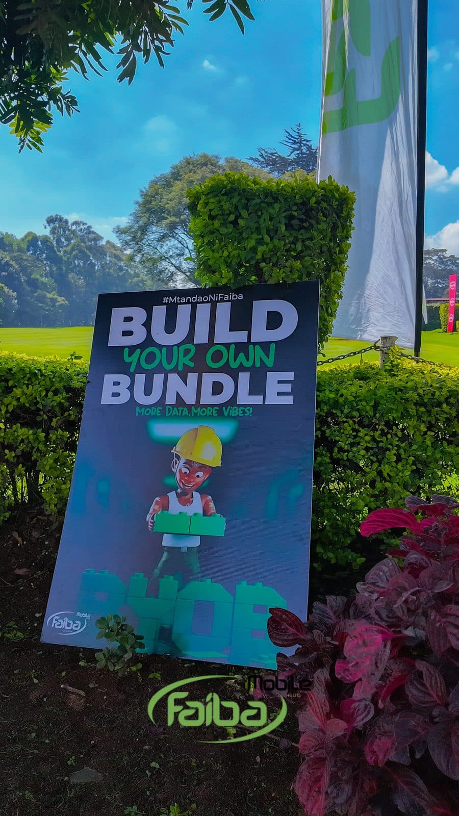 A Build Your Own Bundle poster on the edge of the green, reading More Data More Vibes