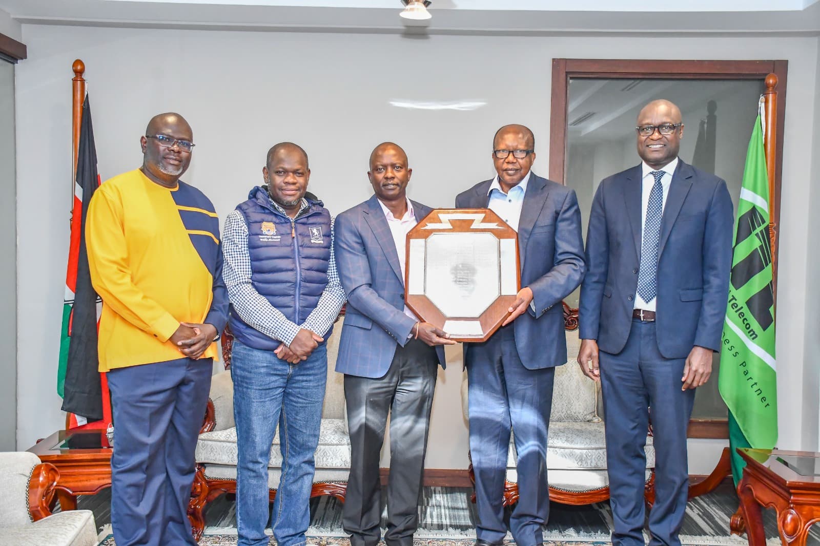Royal Nairobi Golf Club officials presenting the Tannahill Shield to JTL leadership at Jamii Towers