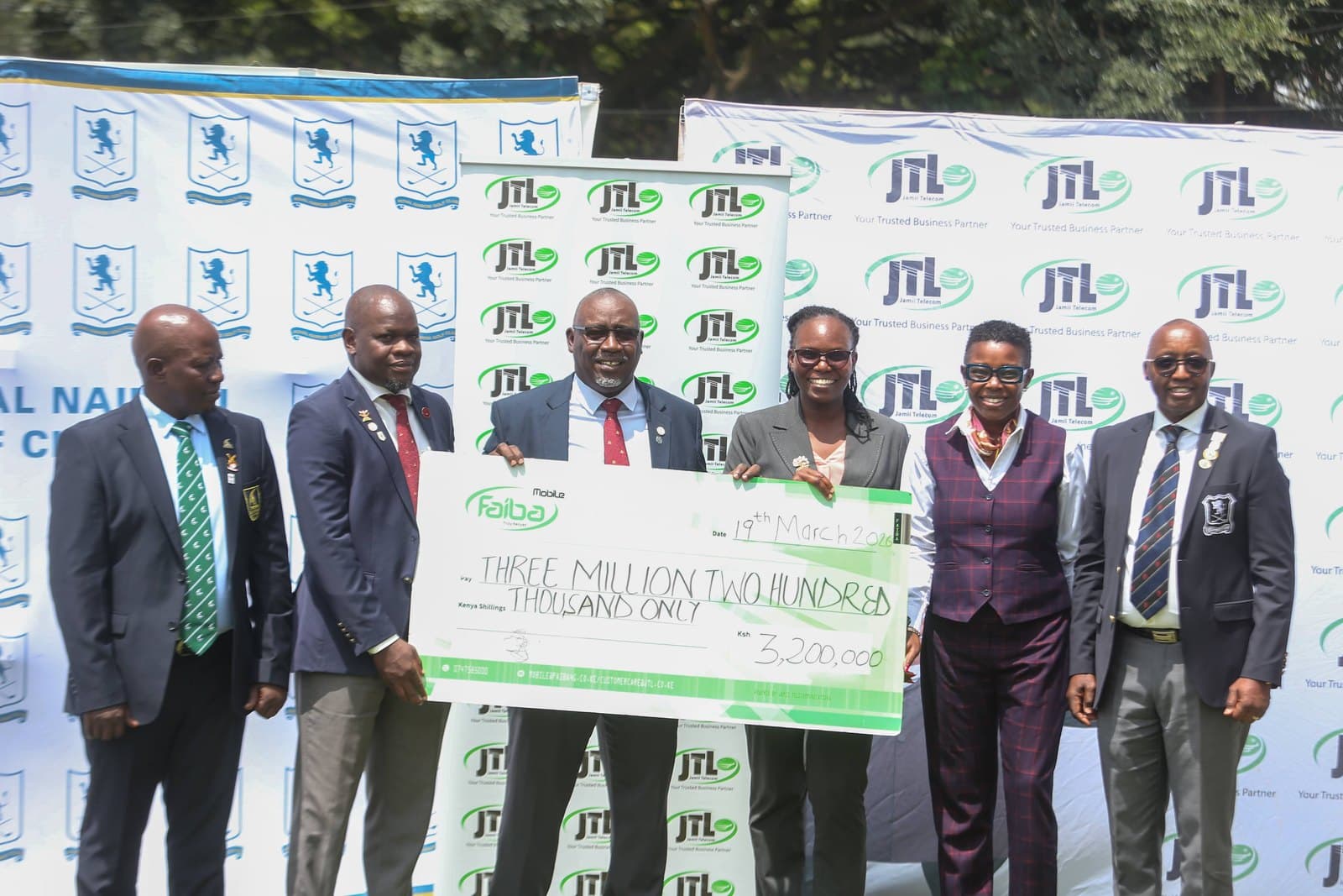 Officials from JTL and Royal Nairobi Golf Club holding a Faiba Mobile cheque for three million two hundred thousand shillings, dated 19 March 2026