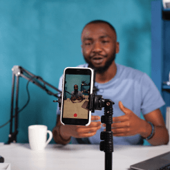 Young Kenyan video creator recording a vlog