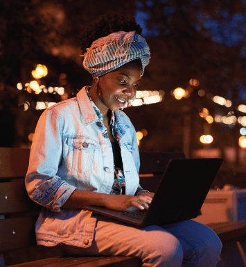 Focused Kenyan university student studying at night