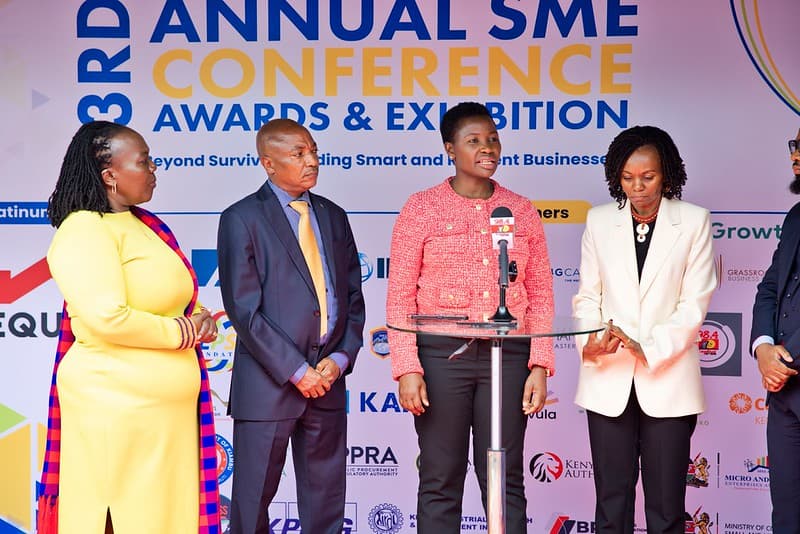  PS Susan Auma Mang'eni, State Department for MSME Development (centre) addressing the press at the SME conference